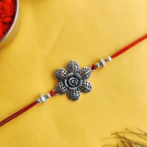 Oxidised Silver Rakhi with Engraved Flower for Brother - Traditional Silver Rakhi Design