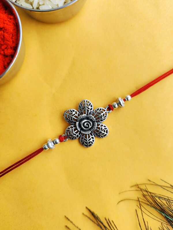 Oxidised Silver Rakhi with Engraved Flower for Brother - Traditional Silver Rakhi Design